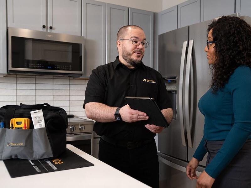 Technician providing a clear appliance repair estimate
